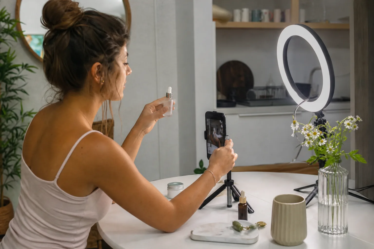 Creator filming a product video with a phone on a tripod
